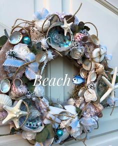 a wreath with shells and seashells on it