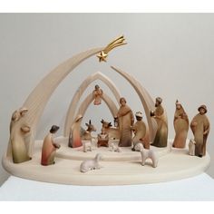 a nativity scene with figurines in the form of animals and a star