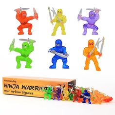 the ninja warrior action figures are next to a box of plastic figurines,