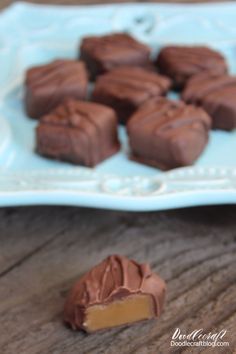 chocolate pieces on a blue plate with a bite taken out