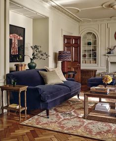 a living room filled with furniture and a fire place