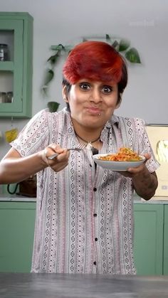 a woman with red hair holding a bowl of food