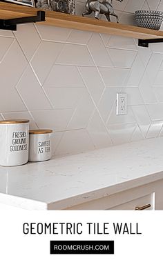 a kitchen counter with two mugs on it and the words geometric tile wall above