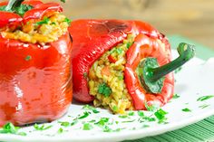 two stuffed peppers on a white plate