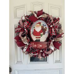 a christmas wreath hanging on the front door