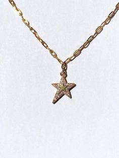 Y2K Magic Star Necklace → y2k gold star charm with a sparkling border of crystals → Charm measures 16 mm x 13 mm, brass based 18k gold plated charm → Stainless steel cable chain, highly resistant against tarnishing → Choose your own chain length, each one comes with a 5 cm extension chain so it is adjustable All of our pieces are tested for months in different solutions before being incorporated into jewelry designs. Quality is super important to us, so all of our pieces are made to last for yea Luxury Star Charm Necklace, Gold Star-shaped Sparkling Jewelry, Gold Sparkling Star Jewelry, Sparkling Gold Star-shaped Jewelry, Wishing Star, Lucky Necklace, Necklace Y2k, Y2k Necklace, Star Necklace Gold