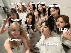 the girls are posing together in their white outfits and name tags on their chests