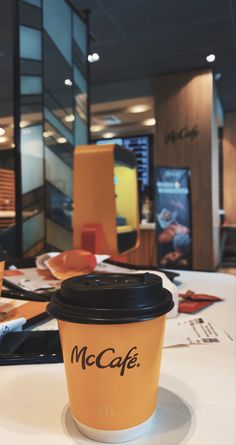 a coffee cup sitting on top of a table