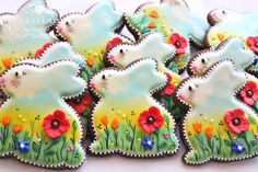 decorated cookies are arranged in the shape of rabbits and flowers on display at a party