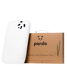 the panda memory foam bamboo pillow is in front of its box and next to it's packaging