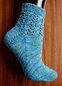 a pair of blue socks hanging from a hook