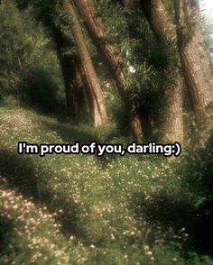 trees and grass with the words i'm proud of you, daring