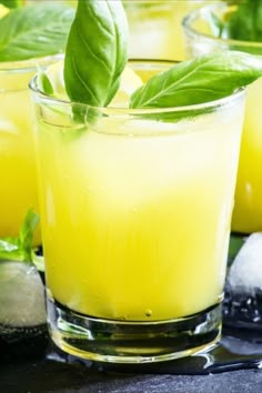 two glasses filled with lemonade and mint garnish