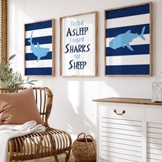 three framed pictures hang on the wall above a wicker chair in a white room