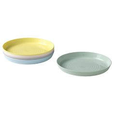 two yellow and white plates sitting next to each other