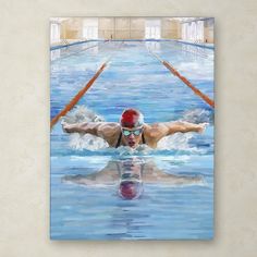 a man swimming in a pool with his arms out and head above the water's surface