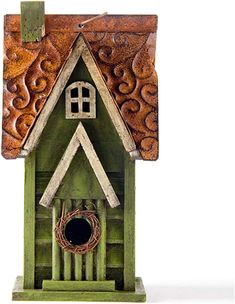 a green birdhouse with a brown roof