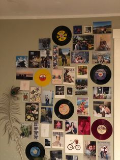 the wall is covered with various records and pictures