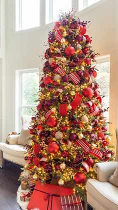 a christmas tree decorated with red and gold ornaments