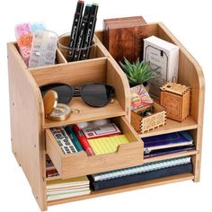 a wooden desk organizer filled with books and office supplies