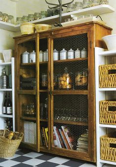 an old wooden cabinet with baskets and jars on it's doors is labeled points of interest chicken wire double door voden cabinet