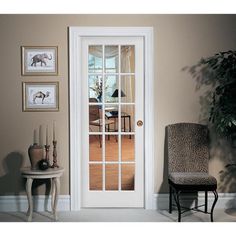 a living room filled with furniture and a white door