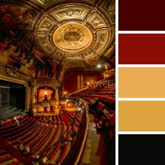 the interior of an old theater with red seats