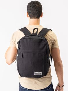 Need a backpack that's both sustainable and practical for college, school everyday use or outdoor activities? Our Earth Backpack is perfect for you. Our spacious and durable Earth Backpack is the workhorse of our line, built for everyday carry with heavy-duty certified organic cotton canvas. The generous main compartment is divided with a no-fuss sleeve for your laptop and one small interior pocket to keep things organized. Two water bottle sleeves and the large zippered exterior pocket keep hyd Cotton Backpack, Feeding America, Bottle Sleeves, Our Earth, College School, Everyday Carry, Black Backpack, Outdoor Activities, Cotton Canvas