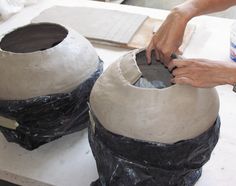 a person is working on some kind of object that looks like it has been made out of clay