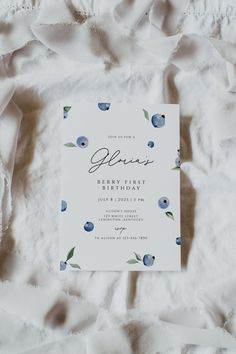 a white sheet with blue flowers on it