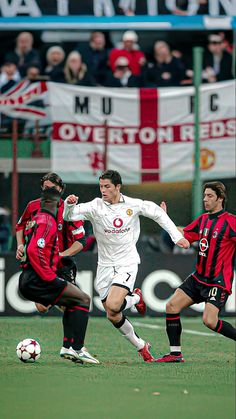 two soccer players in action on the field