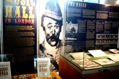 a display case with posters and information about the life of king louis ii in london