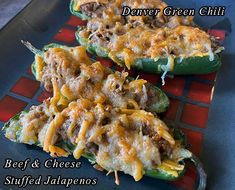 three stuffed peppers with cheese and meat on them