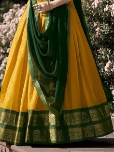 Introducing our stunning great yellow zari weaving kanchipuram silk function wear lehenga choli! This exquisite ensemble features a yellow color Kanchipuram silk lehenga with intricate zari weaving work, paired with a matching green color Kanchipuram silk choli also adorned with zari weaving work. Completing the look is a green color georgette plain dupatta with intricate lace borderwork.
The lehenga is beautifully stitched up to 42 inches in length, with a 3.70-meter flair, while the choli come Green Slub Silk Lehenga For Navratri, Unstitched Yellow Slub Silk Sharara, Yellow Slub Silk Bollywood Set, Traditional Yellow Slub Silk Anarkali Set, Yellow Slub Silk Anarkali Set With Pallu, Yellow Cotton Silk Anarkali Set With Cutdana, Gold Cotton Silk Anarkali Set With Traditional Drape, Yellow Slub Silk Anarkali Set With Dupatta, Yellow Anarkali Set With Traditional Drape