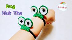 two crocheted bracelets with googly eyes and black cord on the wrist