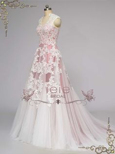 a pink and white wedding dress on display