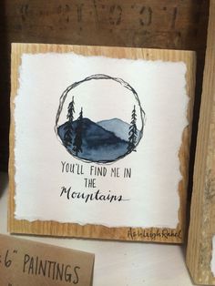 there is a sign on the shelf that says you'll find me in the mountains