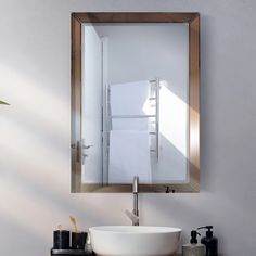 a bathroom sink with a mirror above it