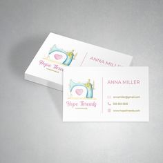 two business cards with sewing machine on them