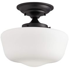 an overhead view of a ceiling fixture with a white glass shade on the top and bottom