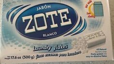 a box of zotee laundry flakes sitting on top of a white counter