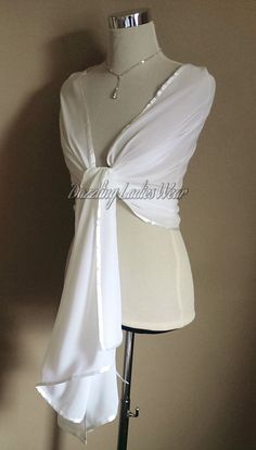 "All of our items are handmade and unique to our company.  Beautiful light ivory/off white chiffon shawls with a satin trim Perfect to drape or wrap around your arms and shoulders.  Fantastic for weddings and formal occasions! Approximate measurements 78\" Long  27\" Wide Lots of other styles/colours available, click on link below to view my Etsy shop -  https://www.etsy.com/uk/shop/dazzlingladieswear?ref=hdr_shop_menu Composition - 100% polyester Due to different screen settings, colours can appear different on different screens, therefore the shade of the item in person, may vary slightly in person to the shade you see on screen." Faux Fur Bolero, Early Spring Wedding, Faux Fur Stole, Bolero Wedding, Bolero Shrug, Chiffon Shawl, Bridal Shawl, Bridal Wrap, Ivory Bridal