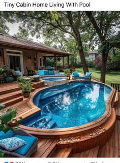 an above ground pool surrounded by wooden decking and blue cushions on the side of it