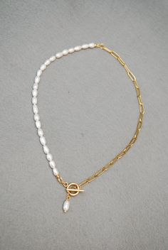 The Half Chain & Half Freshwater Pearl Necklace from Estibela is a beautifully crafted piece of fine jewelry that adds a touch of elegance to any outfit. The necklace is made with high-quality gold stainless steel and features a half chain and half freshwater pearl design. The pearls are carefully selected and handmade, ensuring that each necklace is unique and of the best quality.  Measuring 42cm (17 inches) in length, this necklace is a perfect fit for most people. However, if you prefer a dif Half Pearl Half Chain Necklace, Half Pearl Necklace, Half Chain Necklace, Necklace Elegant, Pearl Design, Freshwater Pearl Necklace, Freshwater Pearl Necklaces, Gold Beads, Matching Earrings