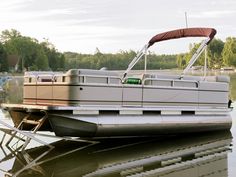 a house boat is parked on the water