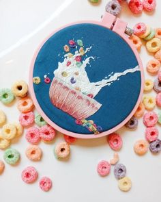 an embroidery project with donuts and cereal on it