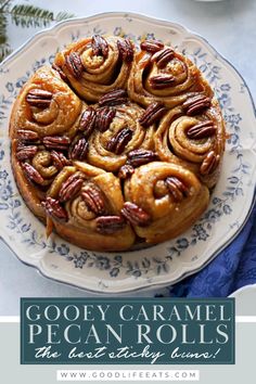 a pecan roll on a plate with the words gooey caramel pecan rolls