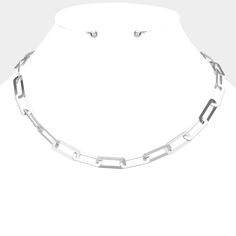 Add some edge to your look with our Rectangle Link Necklace Set in sleek silver. This set features a unique rectangle link design that adds a touch of modernity to any outfit. Elevate your style and stand out from the crowd with this trendy and versatile accessory. (Don't be a square, try our rectangle necklace set!) Color: Silver Length: 17.5" L + 2" Extender Silver Tone Links - Link Size: 0.3" L Earrings Size Ball Stud 0.2" with Post Back Imported Item: WT-584611-04042023450 Rectangle Necklace, Snowflake Pendant, Link Design, Cz Necklace, Stand Out From The Crowd, Chunky Necklace, Blue Glitter, Link Necklace, Necklace Earring Set