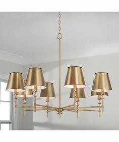 a chandelier with five lamps hanging from it