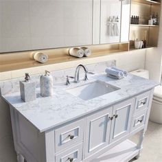 a bathroom vanity with two sinks and mirrors